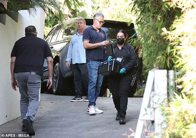 Plain clothing officers also came back and forth from the home