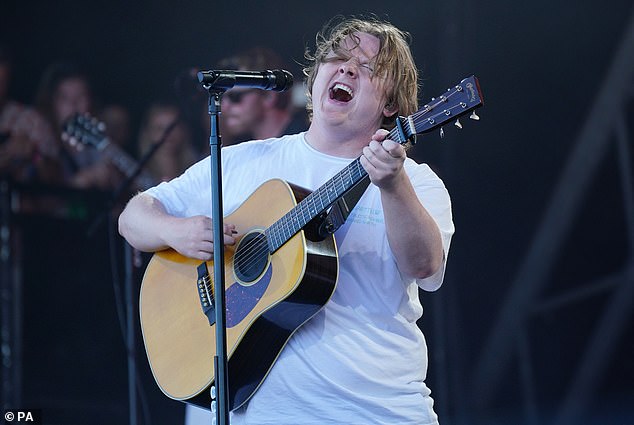 It comes amid reports Lewis' new song will coincide with his big stage return at Glastonbury , two years after he broke down onstage at the festival [pictured]