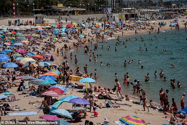 SPAIN: People crowds and cool off at Nova Icaria beach in Barcelona amid a heatwave affecting the Iberian Peninsula