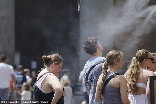 ITALY: Tourists cool off from the summer heat in Pantheon Square, Rome, Italy