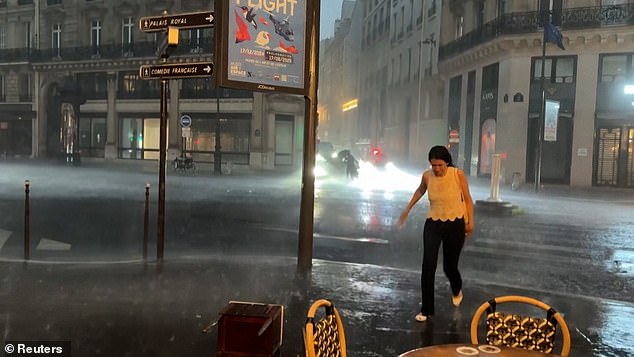 FRANCE: Rainwater flooded the streets of Paris last night