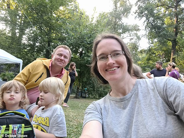 Debbie, pictured with her partner and children, says the Bucharest of today is a modern and stylish capital