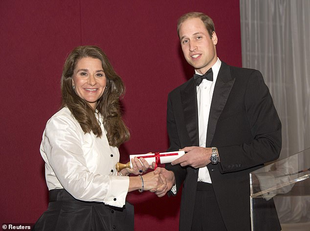 Prince William is pictured in 2014 as he presented Melinda with the Chatham House Prize