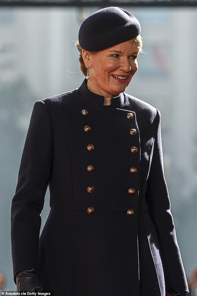 Queen Mathilde put on an elegant display in a smart black coat upon her arrival at the Presidential Palace of La Moneda, in Santiago, Chile