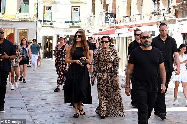 The famous duo certainly attracted plenty of attention as they strolled around Venice with their security in tow