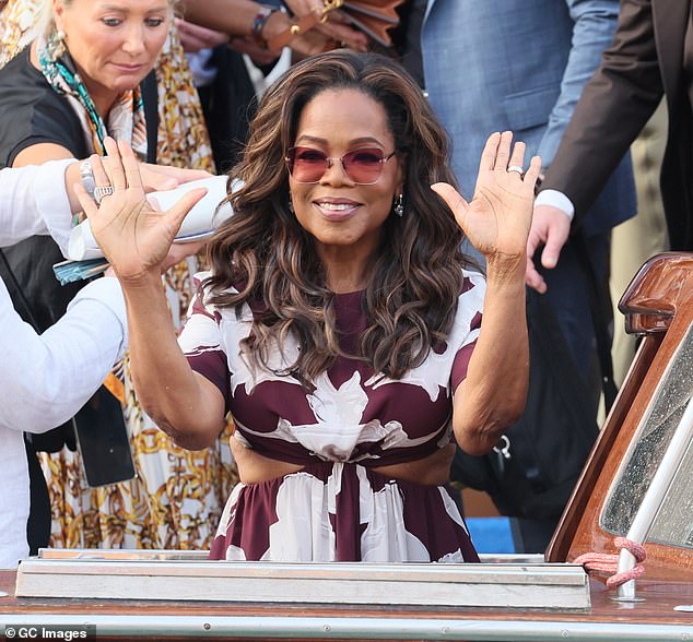 Oprah gave a glimpse at her smaller frame as she attended a party later on Thursday while sporting a purple and white-colored ensemble with small cutouts on the sides