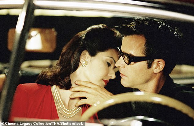 The San Diego-born singer was famed for her performance of Llorando - a Spanish version of Roy Orbison's Crying - in the 2001 film Mullholland Drive (Pictured: Laura Harring and Justin Theroux in the film)