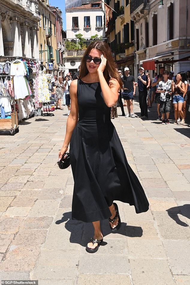 Khloe Kardashian started out the day strong in a elegant black frock alongside her mom, Kris Jenner , as they were spotted strolling in Italy by fans