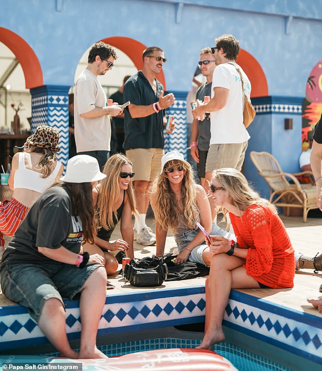 A pop-hotel was erected in the grounds of Worthy Farm and the Barbie star, 37, looked casual in a brown strappy top and shorts sat by the poolside drinking her latest Blood Orange Gin Spritz, in collaboration with Fever Tree