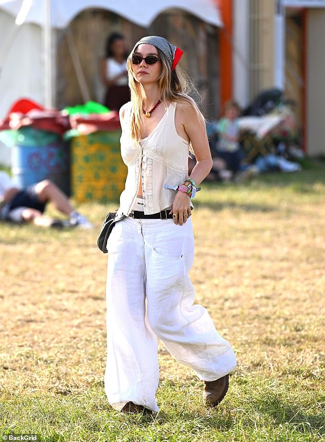 Immy Waterhouse looked chic in a cream linen waistcoat and matching trousers