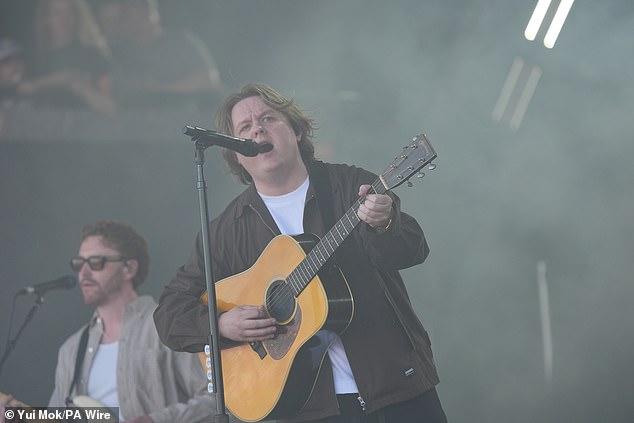 The Scottish singer was greeted with cheers from the huge Worthy Farm crowd, two years after his battle with Tourettes left him unable to finish his perfomance at the festival