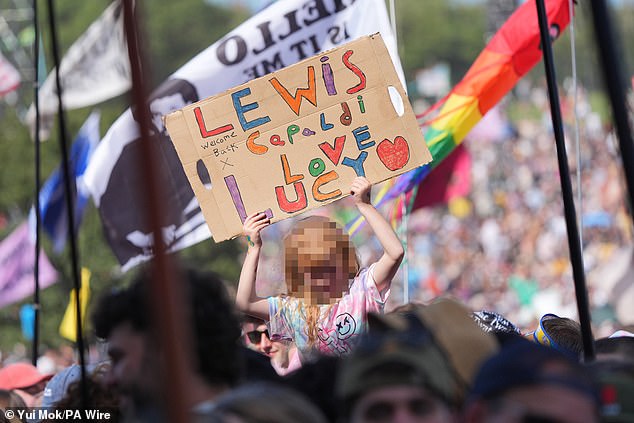 Fans could be seen holding banners and calling his name