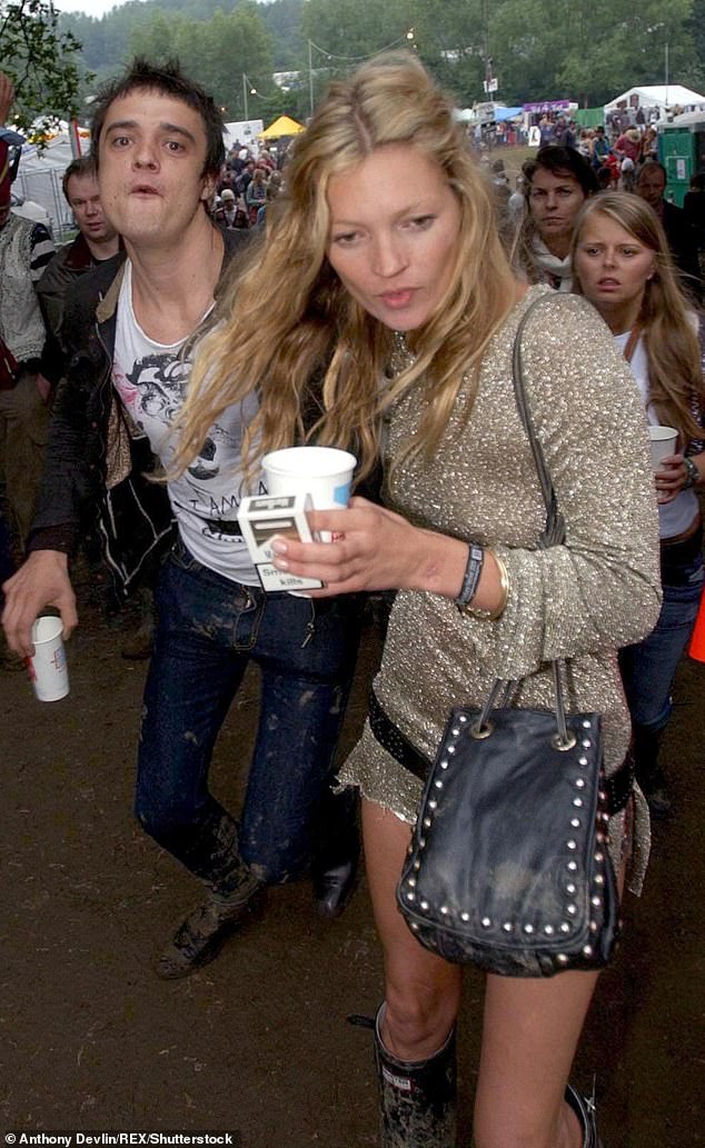 Lottie shared a picture of herself on her Instagram wearing an almost identical sheer chainmail-esque long-sleeve dress, brown belt and Wellington boots (Kate pictured 2005)