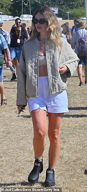 She looked as chic as ever in a light grey quilted Barbour jacket, paired with a sports bra