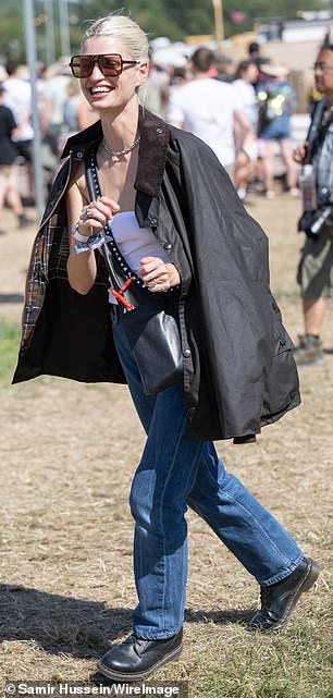 She also wore boots and huge sunglasses