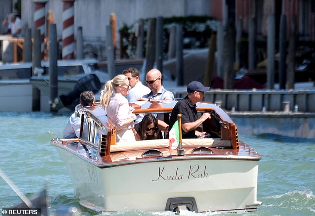 The pair looked relaxed as they enjoyed the European summer weather before hopping on a water taxi toward an unknown destination