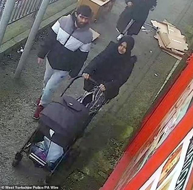 Habibur Masum, 26, walking with his wife Kulsuma Akter and their baby