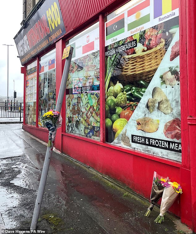 Floral tributes left outside a shop in Westgate, Bradford, close to where Kulsuma Akter was stabbed to death on April 6, 2024
