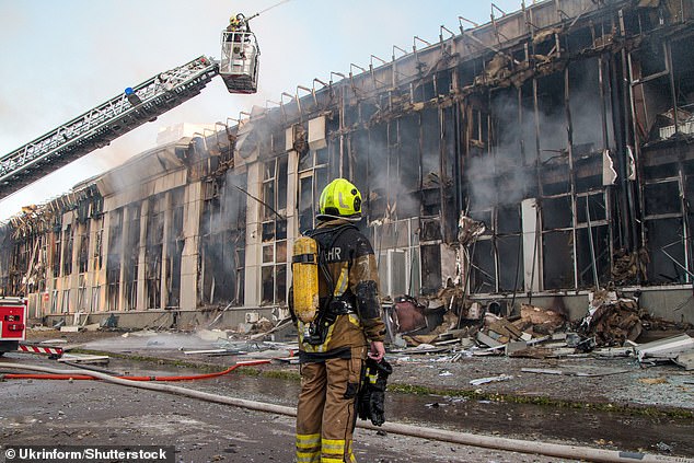 State Emergency Service personnel respond to a fire at a business center after a combined Russian strike in the Solomianskyi district, Kyiv, Ukraine, on June 23, 2025