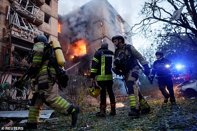 Rescuers work at the site of an apartment building damaged during a Russian strike, amid Russia's attack on Ukraine, in Kyiv, Ukraine June 17, 2025