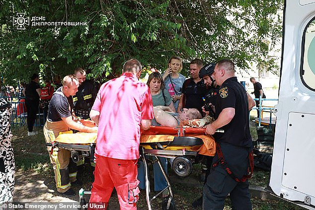 First responders evacuating a wounded man following a Russian missile strike in the eastern Ukrainian city of Dnipro on June 24 2025
