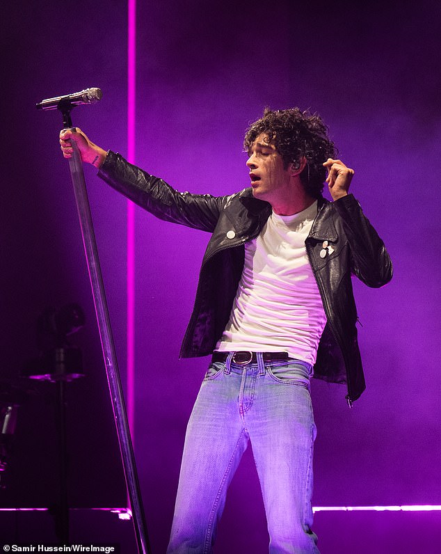 Matty was seen wearing a black leather jacket, white t-shirt and blue jeans, with a pint of stout in his hand on the Pyramid Stage