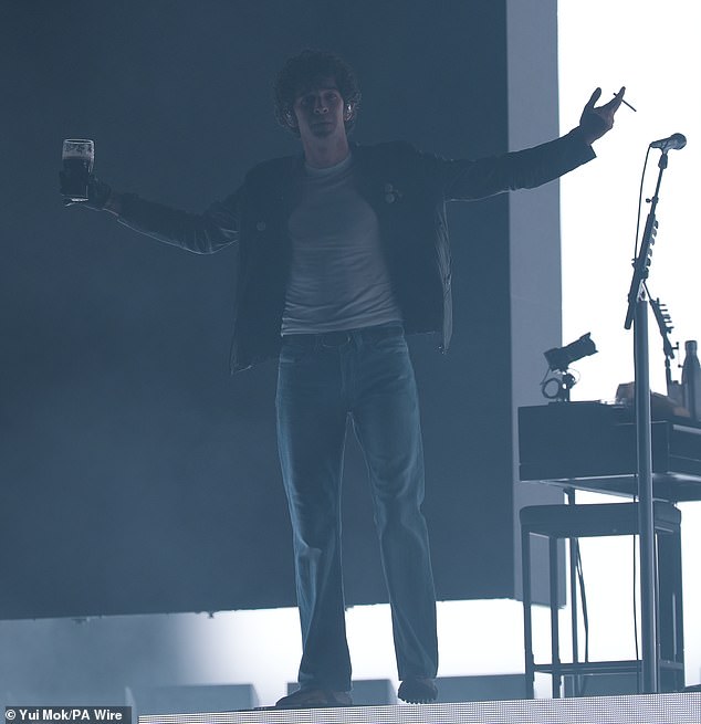After performing Part Of The Band, sat on a stool and smoked while sipping his drink, Healy said: 'What this moment is making me realise is that I probably am the best songwriter of my generation'