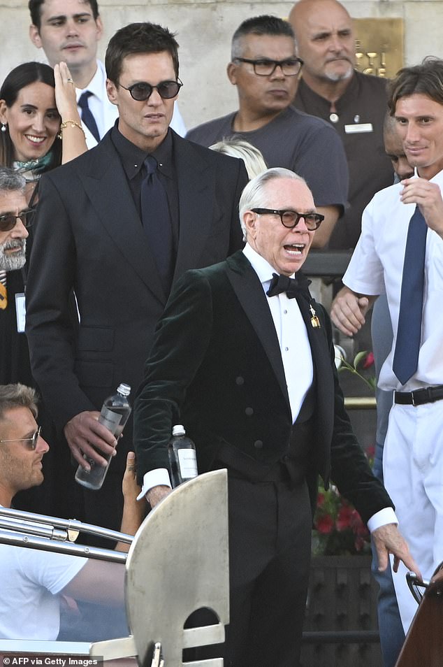 Tommy Hilfiger took a tumble as he boarded the water taxi, declaring the transportation situation as 's**t'