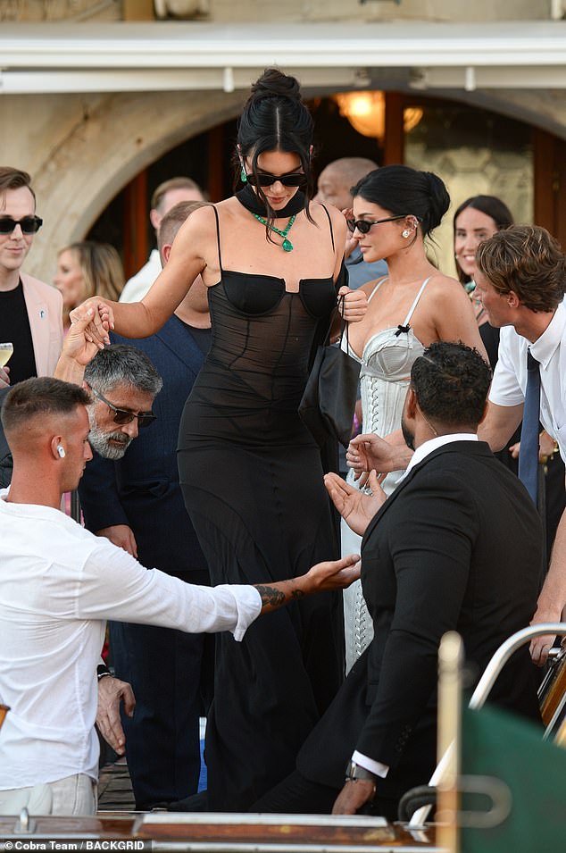 Kylie urged her older sister Kendall, 'Let's hold hands and go together,' before stepping aside and allowing the model to board first