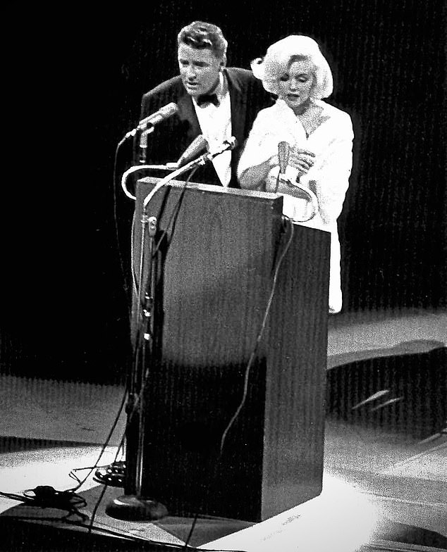 The actor Peter Lawford, one of Sinatra's Rat Pack of celebrities and also Jack Kennedy's brother-in-law, with Marilyn Monroe before her famous birthday rendition to the president