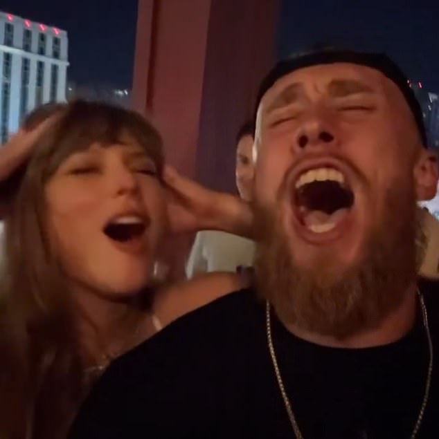 Taylor and Travis (off camera) were seen belting out 'Love Story' with George Kittle (R)
