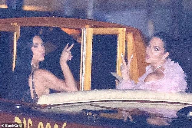 Late last night as the party wrapped, photographers captured Kim and Khloe Kardashian (pictured) making a speedy getaway in a waiting water taxi - throwing up peace signs and flashing duck faces at the camera