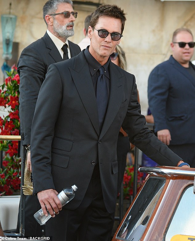 NFL legend Tom Brady (pictured) was reportedly 'chatting up' the Euphoria star Sydney Sweeney while at the hotel bar over the course of the multi-day wedding extravaganza