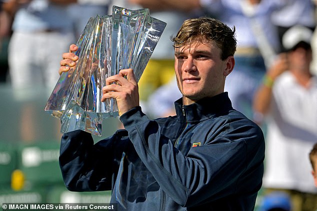 Draper holds the spoils after securing the biggest title of his career, the Indian Wells Masters