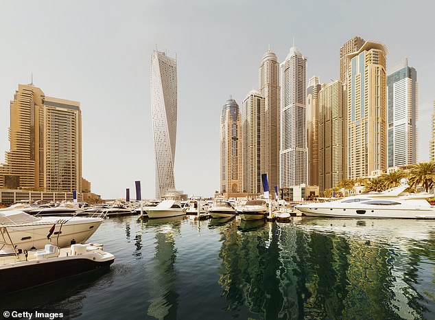 When June came, the Italian said he began 'looking for mess' - but to no avail. Pictured: Warm sunset light at Dubai Marina