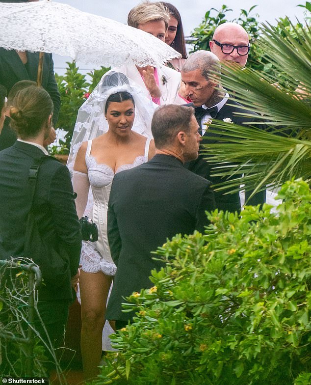 In 2022, Kourtney Kardashian donned a lace and satin corseted mini-dress by the designer to marry Travis Barker in Portofino
