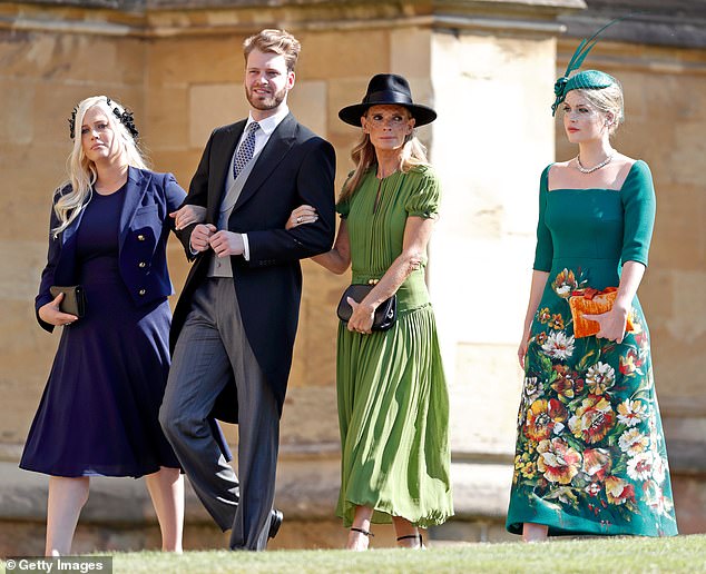 Princess Diana 's niece Lady Kitty Spencer topped the best dressed lists at the Duke and Duchess's wedding in 2018 (right), dazzling in a green floral dress from the Italian fashion house after modelling for the brand on several occasions