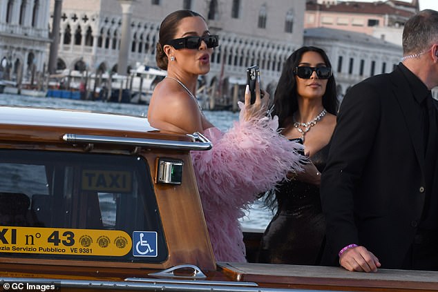 The sisters appeared to be in excellent spirits on the night as they were spotted making their arrival on a boat