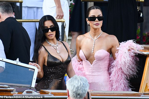 She put on a busty display in the look and added a statement jewelled necklace to her ensemble