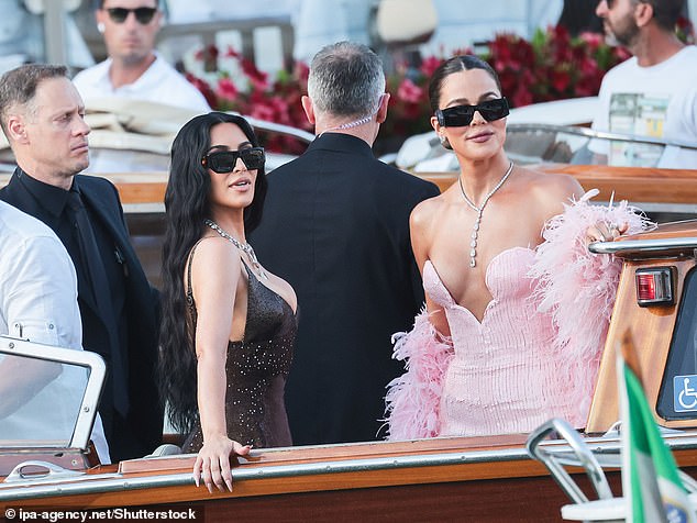 She was joined by her sister Khloe who put on an equally glamorous display in a strapless pink gown with a feathered shawl