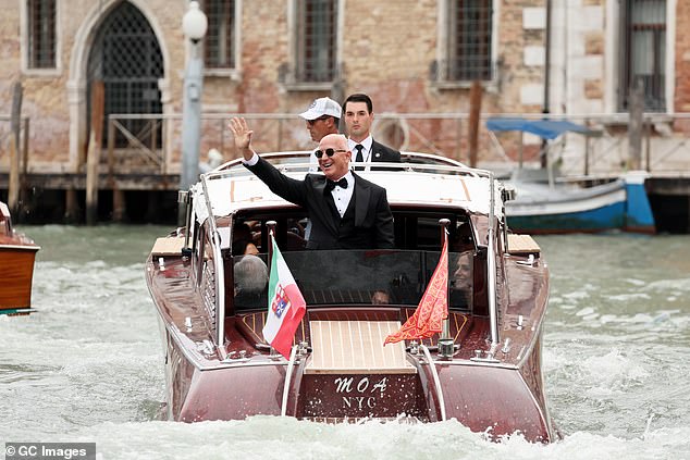 Jeff Bezos waved and appeared in high spirits ahead of his wedding to Lauren Sanchez on Friday