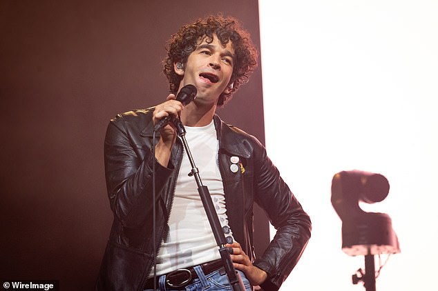 In their first and only gig of the year, frontman Matty Healy , 36, was in great spirits as he smoked a cigarette and drank a pint of Guinness before belting out a number of the band's hits