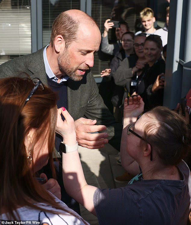 The royal fan, upon meeting William, appeared completely starstruck and held out her arms for the Prince to hug her