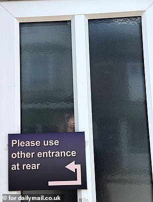A sign on the brother's front door instricts punters to use the entrance at the rear of the building