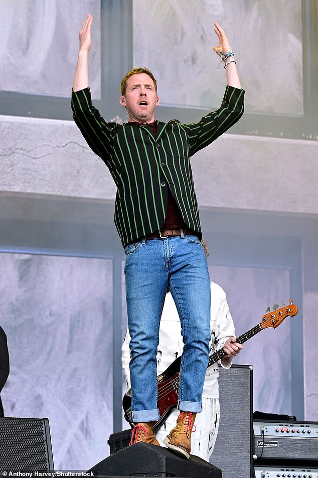 He cut a casual figure in jeans and a green striped jacket, which he styled with chunky brown boots