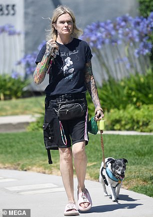 Erika's tattoos suited her casual outfit, which included a black graphic T-shirt