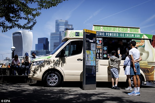 People queue for an ice-cream van as they try to beat the heat with cold food in London