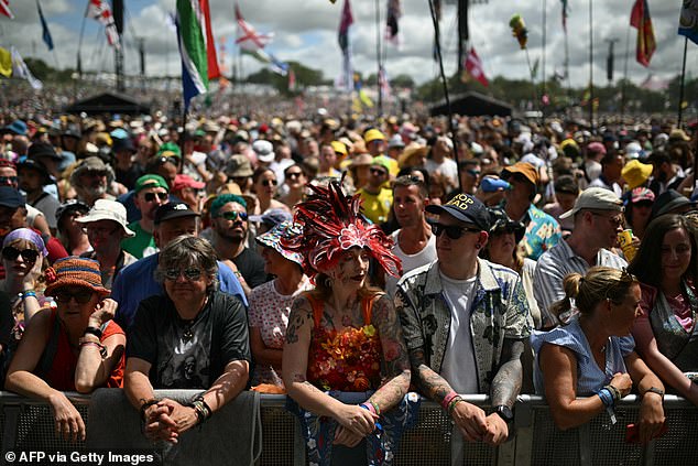 Festivalgoers await Glastonbury headliners Kaiser Chiefs on the Pyramid Stage