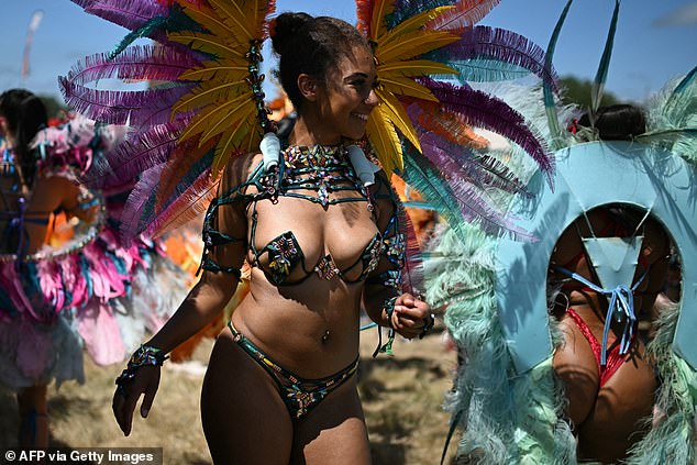Performers from the Notting Hill Carnival dance in the Carhenge area on the fourth day of Glastonbury