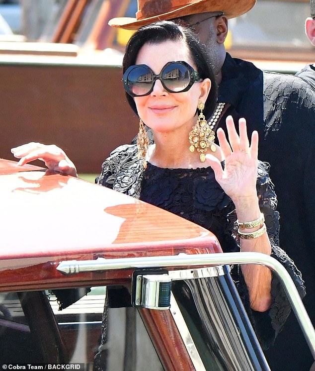 Leave it to Kris Jenner, 69, to outshine the entire Kardashian-Jenner family. As she was getting into a water taxi, Kris was seen wearing a black lace dress, dangly golden Dolce and Gabbana earrings retailed at $1,275, and chic round oversized sunglasses. She wore her hair in a sleek side part that complimented her glasses